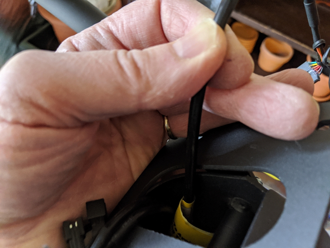 E95 Step 1-3 09 Holding the computer cable taut (per yellow warning).jpg