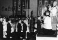1962 2 John McWeeney & Karen, First Communion (next in line, bottom of steps).jpg