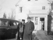 1950-10-14~ Edith and Clarence Razee at the back of their house, Woodbridge CT.jpg