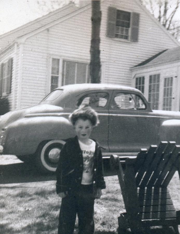 1955-05-01~ 6 Dan as Davy Crockett; our green Plymouth coupe (HBD Dad & Dan).jpg