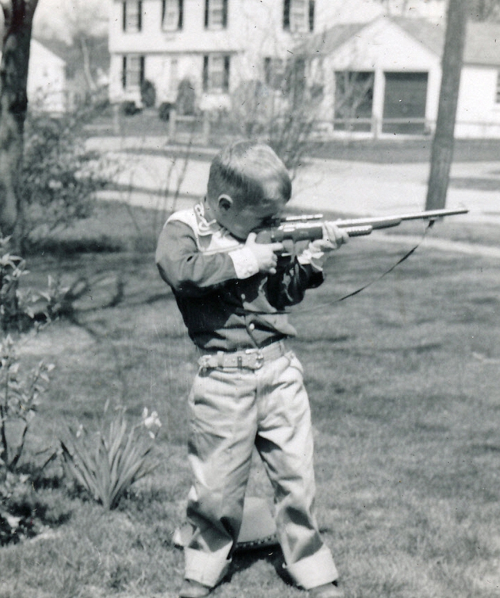 1955-05-03 1 Dan's birthday outfit, new rifle & early daffodil.jpg