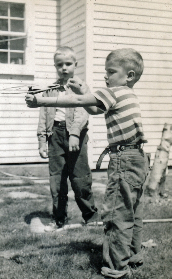 1955-05-14~ 2 Pete Jr watches Dan launch flying saucer.jpg