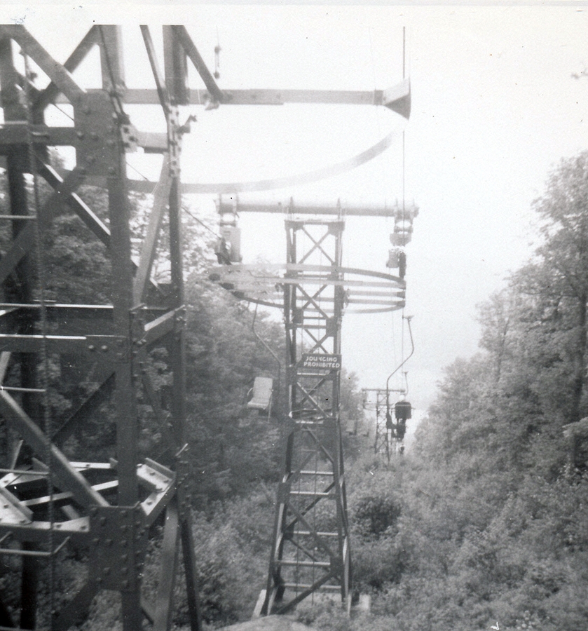 1959-08-early 6 Looking down on the lake, chair lift on top of Mt Sunapee.jpg