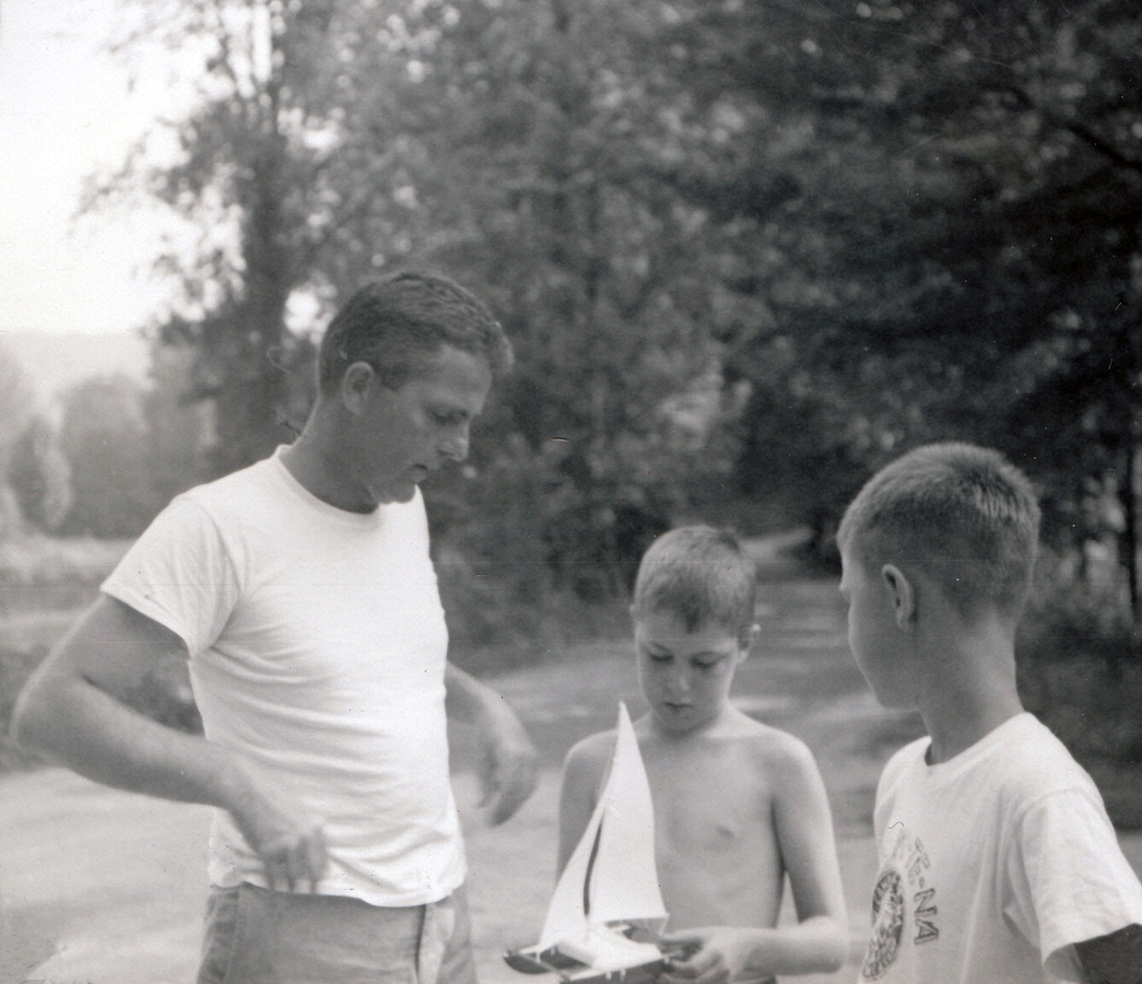 1960-08 25 Pete Sr explains a catamaran to Dan & John, Weare NH.jpg