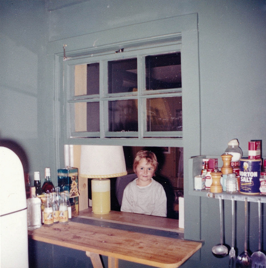 1961-09-03~ 02 Andrea in window between kitchen and playroom, Islesboro ME.jpg