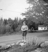 1964-10-12~ 1 Andrea on rock garden in front of house, Islesboro ME.jpg