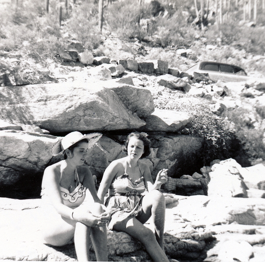 1954-10-15 1 Til & Jane cooling their feet, stone tub, Sabino Canyon, Tucson AZ.jpg