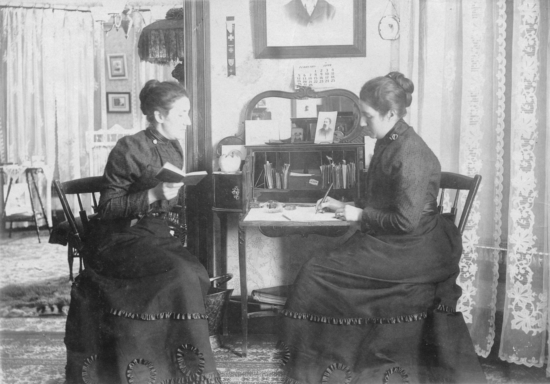 1900~ Liz Perry watches herself write a letter, 801 Elm St, New Haven.jpg