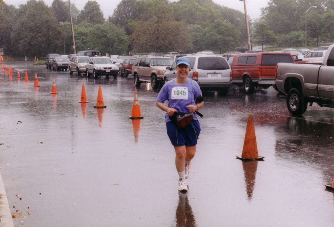 2004-09-18 1 Karen finishing Team With A Vision 5K in a downpour.jpg